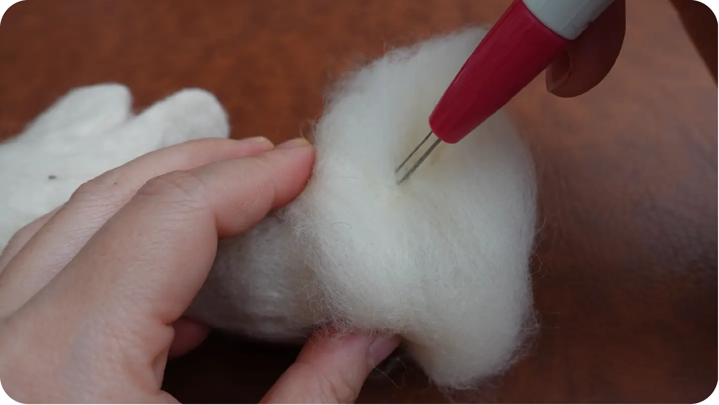Needle-felted portrait making process step 2