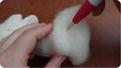 Needle-felted portrait making process step 2