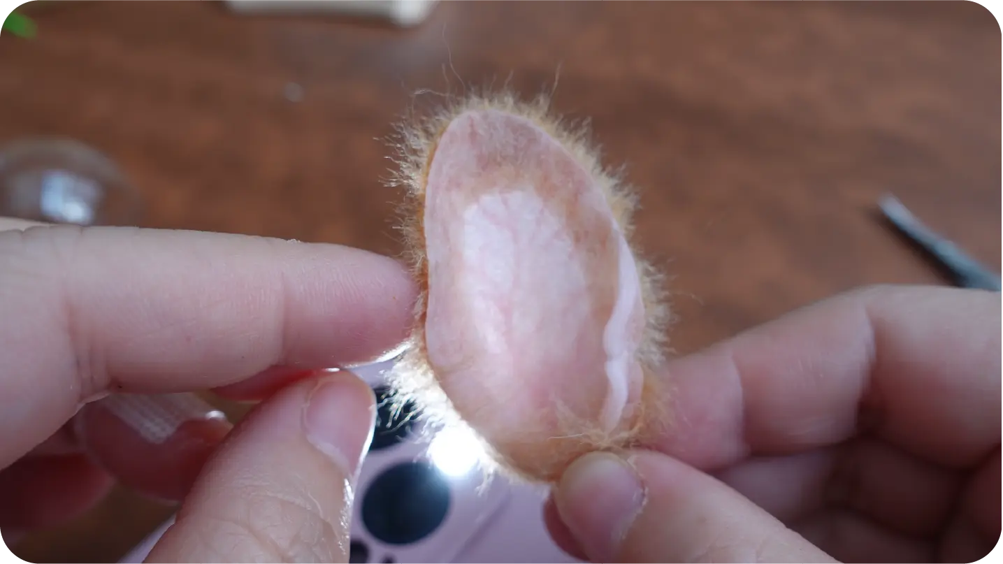 Needle-felted portrait making process step 4