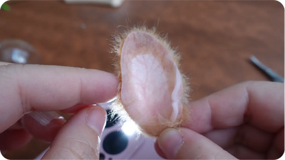 Needle-felted portrait making process step 4