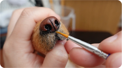 Needle-felted portrait making process step 5