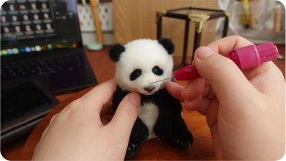 Needle-felted portrait making process step 8
