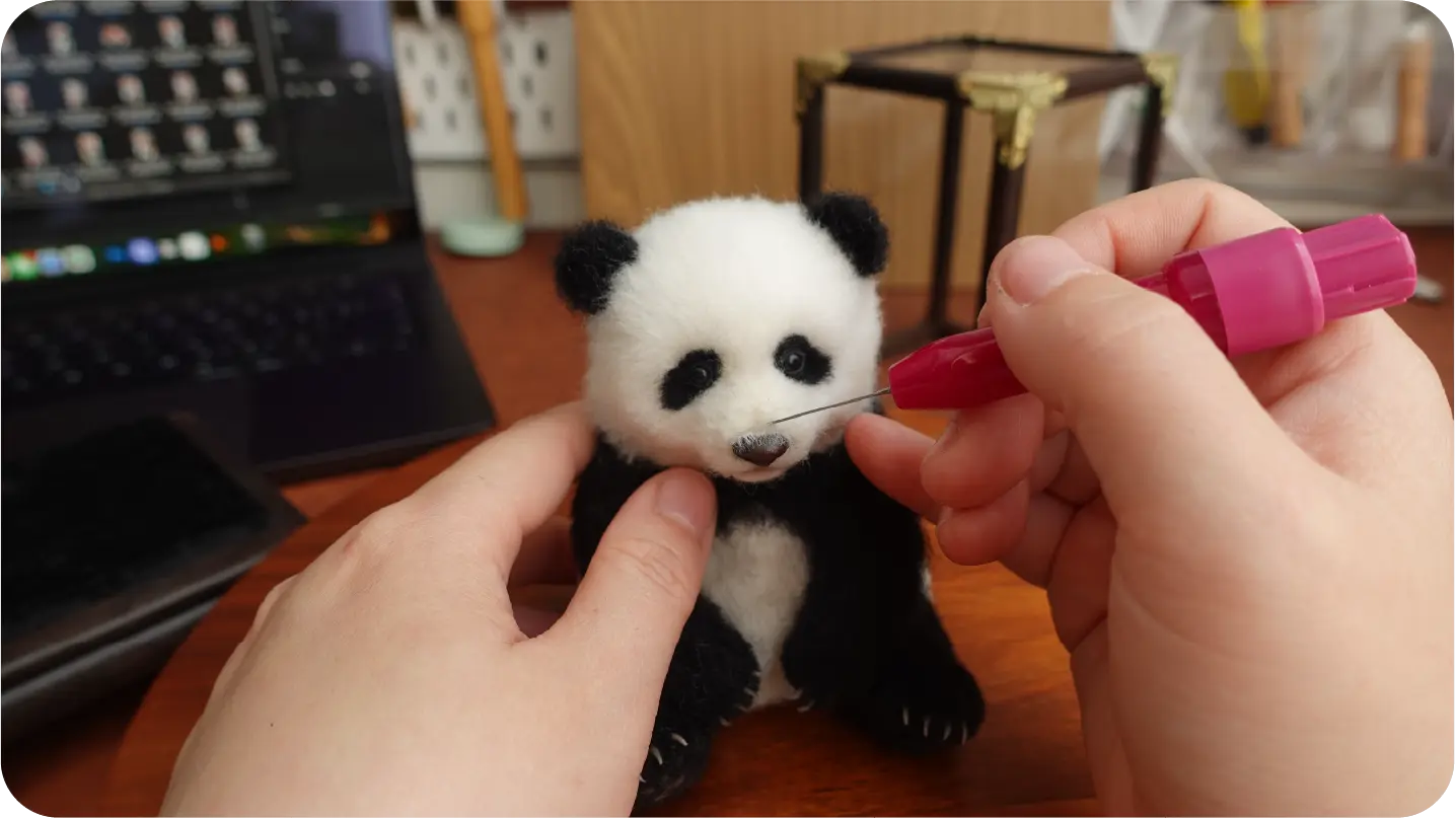 Needle-felted portrait making process step 8